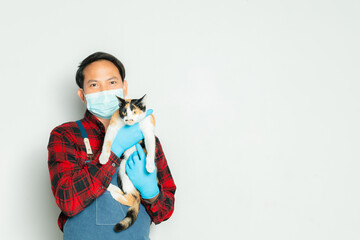 Pet owner affectionately holds a cat of 3 colors.