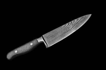 Knife blade of Damascus steel isolated on black
