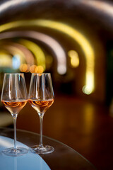 Tasting of brut champagne sparkling wine produced by traditional method in underground caves