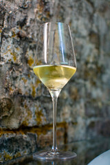 Tasting of brut champagne sparkling wine produced by traditional method in underground caves