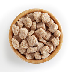 Cubes of brow cane sugar in wooden bowl isolated on white background with clipping path