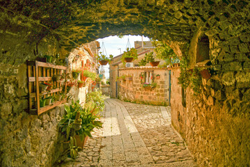 A narrow street among the old stone houses of the oldest district of the city of Caserta.