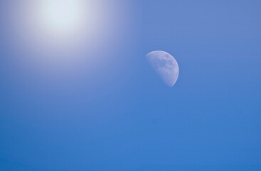 Moon in a Fantasy Sky with Rays of Sunlight