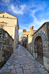 A narrow street among the old stone houses of the oldest district of the city of Caserta.