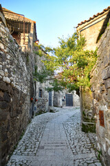 A narrow street among the old stone houses of the oldest district of the city of Caserta.