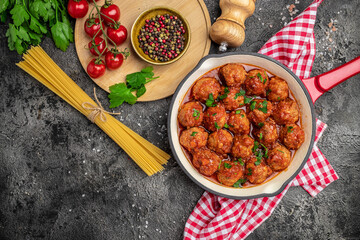 Pan with Italian pasta with tomato sauce and meatballs. Restaurant menu, dieting, cookbook recipe top view