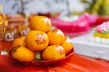 Orange with auspicious Chinese characters meaning double happiness. Auspicious fruit for Chinese wedding ceremonies.
