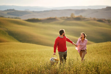 Female and male having fun in nature