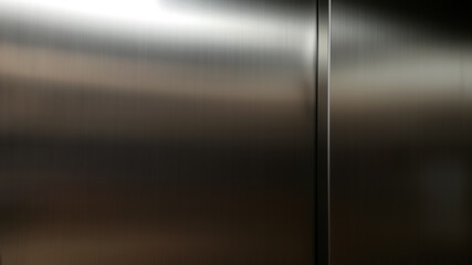 stainless steel sheet in the dark,Inside passenger elevator,Reflection of light on a shiny metal...