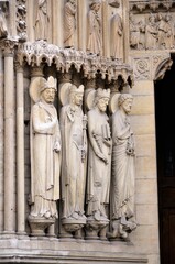 Paris, France - famous Notre Dame cathedral facade saint statues. UNESCO World Heritage Site