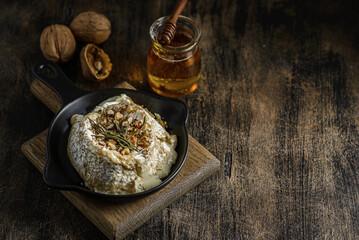 baked brie cheese on a wooden board