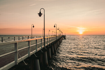 Fototapeta premium Gdynia Orlowo pier in the morning with colors of sunrise. Baltic Sea, Poland