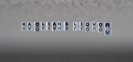 kaoliang liquor word or concept represented by black and white letter cubes on a grey horizon background stretching to infinity