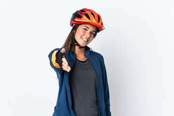 Young cyclist brazilian girl isolated on white  background shaking hands for closing a good deal