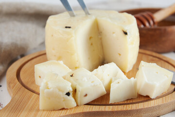 Cheese collection, craft cow and goat milk cheese, wooden table