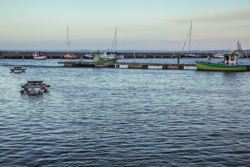 Picnic tables set in the North Sea at a ferry port in evening Denmark
