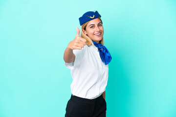 Airplane stewardess Uruguayan woman isolated on blue background with thumbs up because something good has happened
