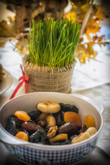 Orthodox Christmas offerings including young green wheat and dried fruit on a table