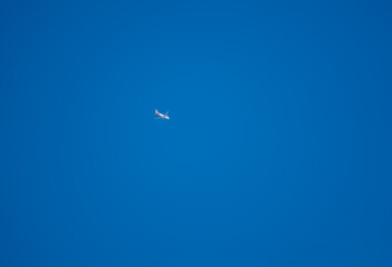 easyjet Airbus A320 twin engine white and orange jet airliner aeroplane in a clear deep blue sky 