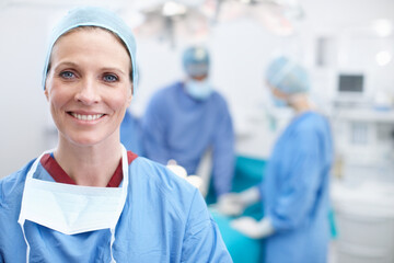 Laughter and happiness are the best medicine. Portrait of a mature female doctor smiling in an operating room. - Powered by Adobe