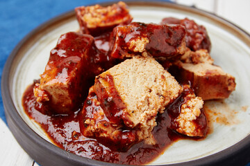 Tofu meat with tomato sauce on plate