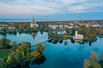 Panoramic aerial view of Holgin pond and the islands with pavilions in Peterhof,Peter and Paul Cathedral, wooden bridge to the island, reflected in the water, photo for a postcard