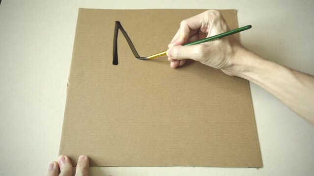 Writing "No War" on a cardboard