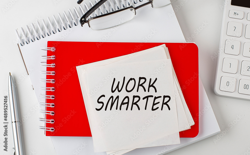 Poster work smarter word on the sticker on notepad with pen and calculator