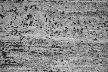 Gray Cracked Stone Wall Background, Surface Cave Rock Wall.Gray Stone Texture Background. Close Up Mineral Texture.