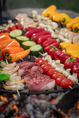 Tasty and healthy grilled shashlik on grill grate with fire.