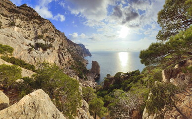 Summer in Crimea. Russia. Black Sea. Novyi Svit. View from Golitsyn Path. Beautiful Views of the Mountains and Rocky Coast of the Black Sea. Picturesque sea landscape. Beach in Crimea. Forest.