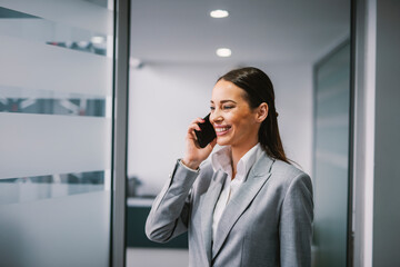 A businesswoman having business call at the office.