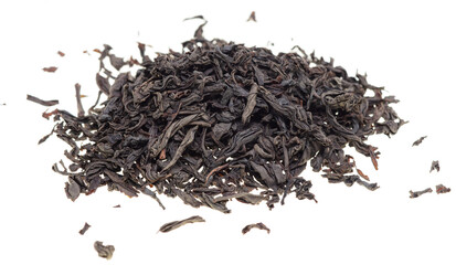 Dried black tea leaves on a white background.