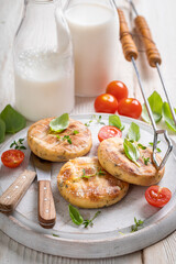 Crispy roasted halloumi cheese with cherry tomatoes and basil.