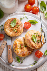 Tasty grilled halloumi cheese as summer delicacy in garden.