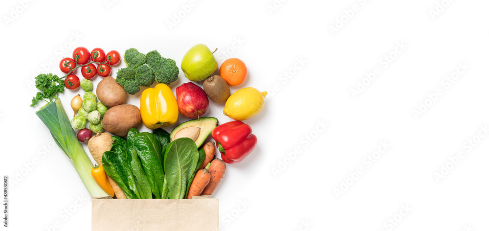 Wall mural Healthy food background. Healthy food in paper bag vegetables and fruits on white. Food delivery, shopping food supermarket concept