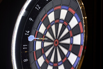 darts board on a black background. game center.