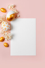 Happy Easter Card Mock up. Empty card with Easter golden eggs, candy and flowers  on pastel pink background. Holiday concept.