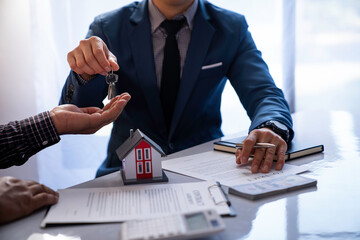 Real estate company to buy houses and land are delivering keys and houses to customers after...