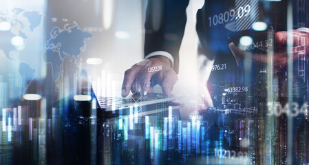 Businessman working on laptop with financial graph, analyzing marketing data and futuristic technology background, double exposure with smart city. Business and modern technology