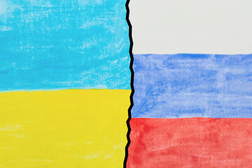flags of Russia and Ukraine painted on paper. Russian versus Ukraine trade third world war disputes and anctions policy concept