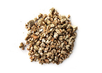 Exfoliated vermiculite isolated on white background. is a versatile hydrous phyllosilicate mineral...