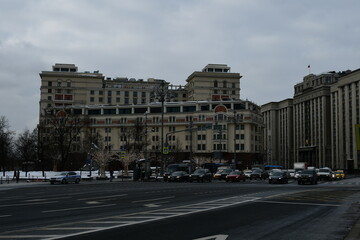 Fototapeta na wymiar Panorama of the city street. The building of the Four Seasons Hotel and the State Duma of the Federal Assembly of the Russian Federation. February 11, 2022, Moscow, Russia.