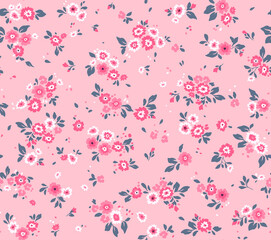 Vintage floral background. Floral pattern with small pink flowers on a pale pink background. Seamless pattern for design and fashion prints. Ditsy style. Stock vector illustration.