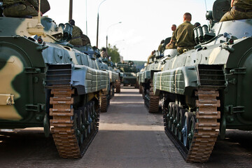 Fototapeta premium Russian tanks troops army machines on the street heading out to war
