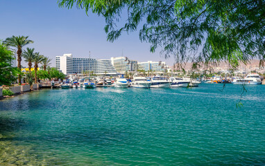 Central marina with pleasure tourist, entertainment, fishing and cruise motorboats and resort and vacation hotels for tourist from Israel and all outdoors