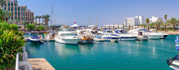 Central marina with pleasure tourist, entertainment, fishing and cruise motorboats and resort and...