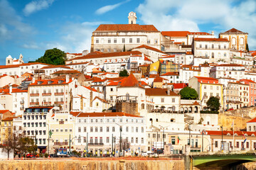 View of the city of Coimbra at the golden hour. View of the left bank of the Mondego River.
