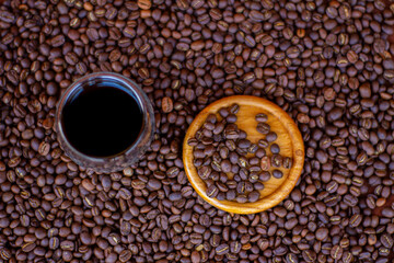 Black coffee cup on coffee beans background
