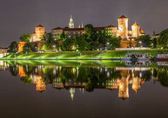 Fototapeta na wymiar Krakow, Poland - nearly 1000 years old and part of the Unesco World Heritage Old Town Krakow, the Wawel Castle is a wonderful example of several architectural styles. Here the castle at night